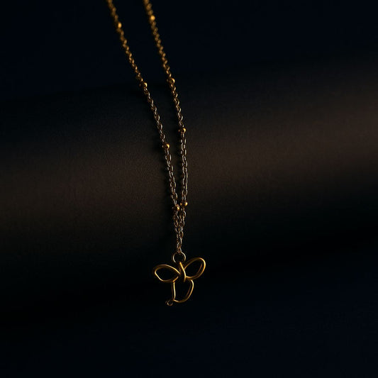 Delicate Gold Bow Pendant Necklace - Navya Jewelry